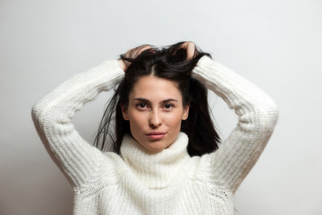 Naklejka premium Beautiful brunette woman intense close up portrait on white background.