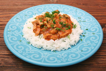 Rice with meat in tomato sause