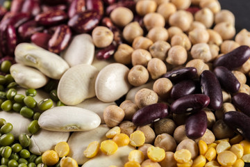 mix of beans on wooden table