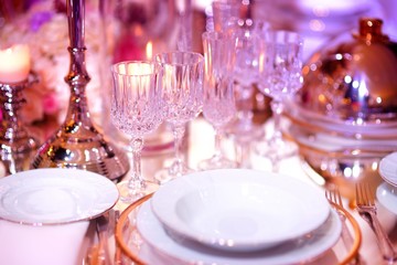 Beautiful table setting with crockery and flowers for a party, wedding reception or other festive event