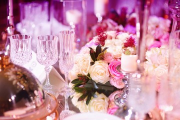 Beautiful table setting with crockery and flowers for a party, wedding reception or other festive event