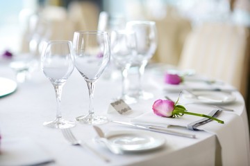 Beautiful table setting with crockery and flowers for a party, wedding reception or other festive event