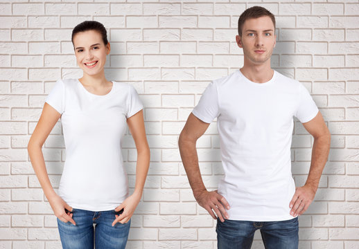 Shirt Design And People Concept - Close Up Of Young Man And Woman In Blank White T-shirt Isolated.