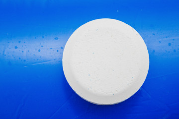 Chlorine Pellets on the edge of an inflatable pool