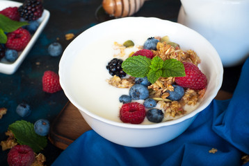 Greek yogurt with granola and fresh berries.