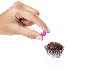 Traditional candy from Brazil called brigadeiro over white background