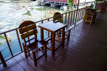 Chairs with wooden table on the terrace