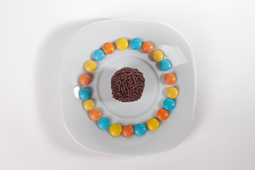 Traditional candy from Brazil called brigadeiro over white background