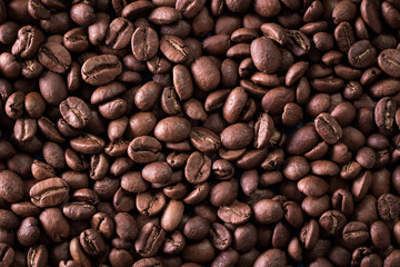 roasted coffee beans on blue table, can be used as a background