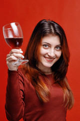 Woman  with glass of red wine ih her hand