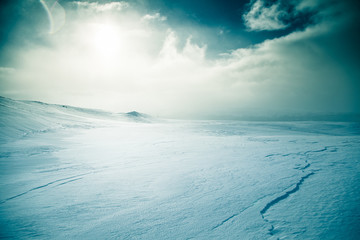 Naklejka na ściany i meble A beautiful, artistic, minimalist landscape with a lot of snow in the Norwegian winter