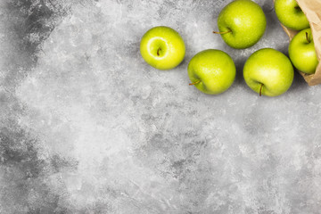 Ripe green apples on a light background. Top view, copy space. Food background