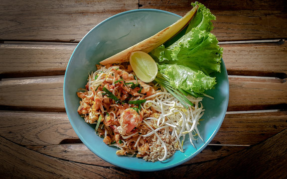 Thai food Pad thai on wood background.