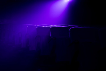 Empty movie theater with projection light falling into the lens 
