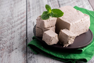 Sunflower halva on the wooden table background