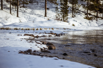A beautiful landscape with a frozen river in the Norwegian winter