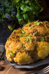 Stuffed cauliflower with mince and Hasselback potatoes
