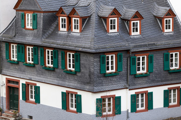 Fototapeta premium Typical German house with windows with shutters looks like a toy