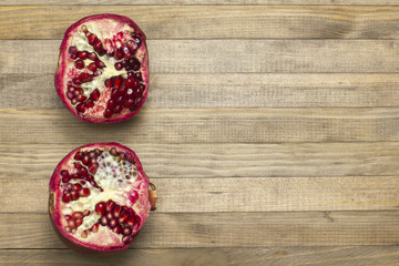 pomegranate fruit lay on wooden table