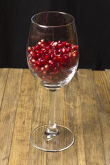 pomegranate seed inside transparent wine glass