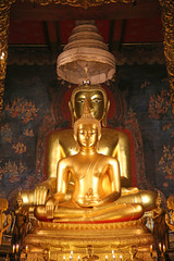 Fototapeta premium Beautiful of golden Buddha statue and thai art architecture in Wat Bovoranives, Bangkok, Thailand.