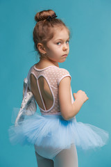 The little balerina dancer on blue background © master1305