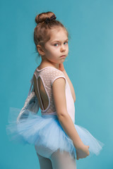 The little balerina dancer on blue background © master1305