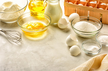 Ingredients for making pancakes on a white background. Copy space.