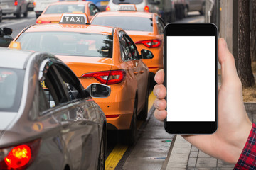 Hand and phone with white screen. The idea for the application by the order taxi