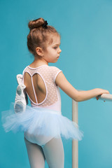The little balerina dancer on blue background © master1305