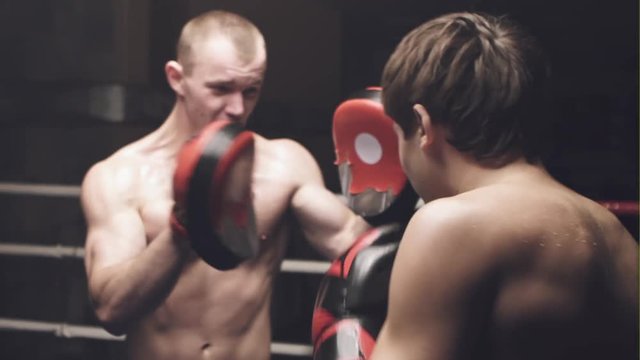 Two professional boxers training on the grand arena