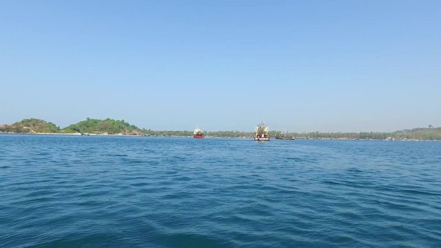 Boat ride at Bay of Bengal near to fishing village at Ngapali Beach in Myanmar.