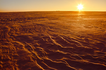 Martian sunset (Mars planet) red landscape. Looks like cold desert on Mars. A huge field of ice