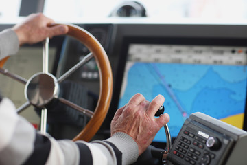 The hands of the captain and a steering wheel boat port services - 139233515