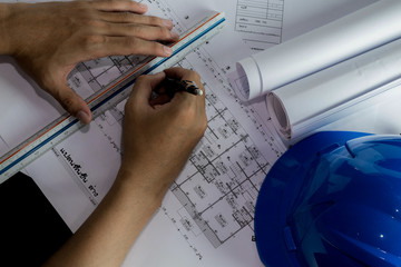 Workplace of architect - Architect rolls and plans.architectural plan,technical project drawing. Engineering tools view from the top. Construction background.