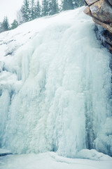 Fototapeta na wymiar A beautiful close-up of a frozen waterfall in the Norwegian winter