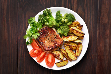 Grilled meat with vegetables, top view