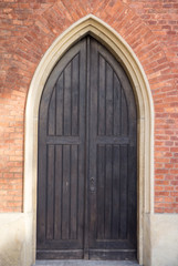 Old vintage wooden black door close-up