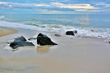 Fototapeta premium Seashore Summer Sunrise Over Rock Jetty