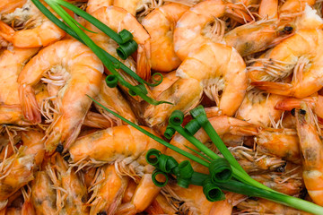 Closeup shot of baked shrimp with salt and spring onion.