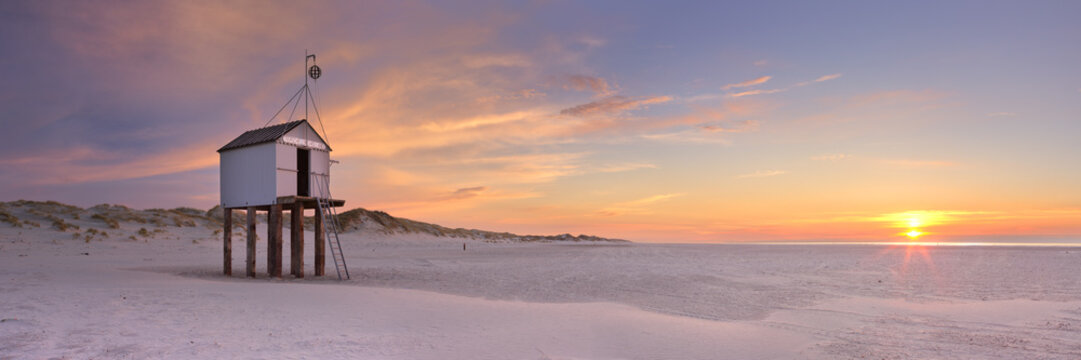 Refuge hut on Terschelling island in The Netherlands at sunset