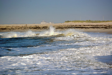 Waves Washing Up onto the Beach Along the Coastline