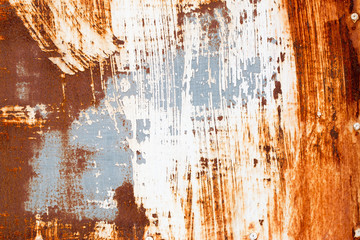 A background of peeling paint and rusty old metal
