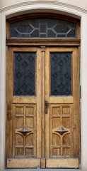 Obraz na płótnie Canvas Old vintage wooden yellow door close-up