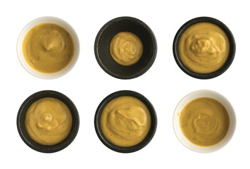 Set of Mustard Sauce in Round Bowls Isolated on White Background
