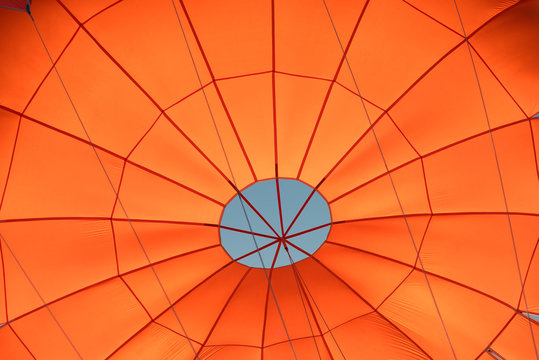 Photo of a red parachute from inside