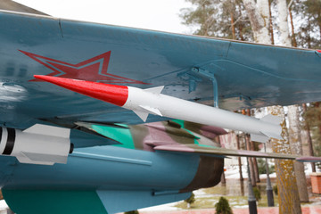 The rocket is attached to a plane wing in the wood