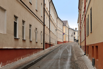 Fototapeta na wymiar Old narrow street of Grodno in perspective. Belarus.