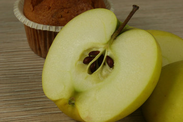 Chocolate muffin and apple closeup