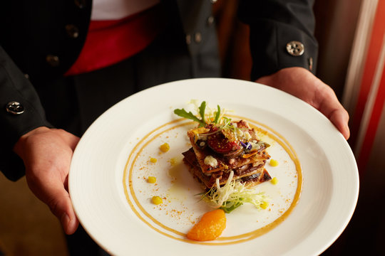 Plate of gourmet food with decorative garnish